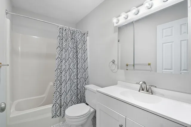 a view of a hallway with washer and dryer