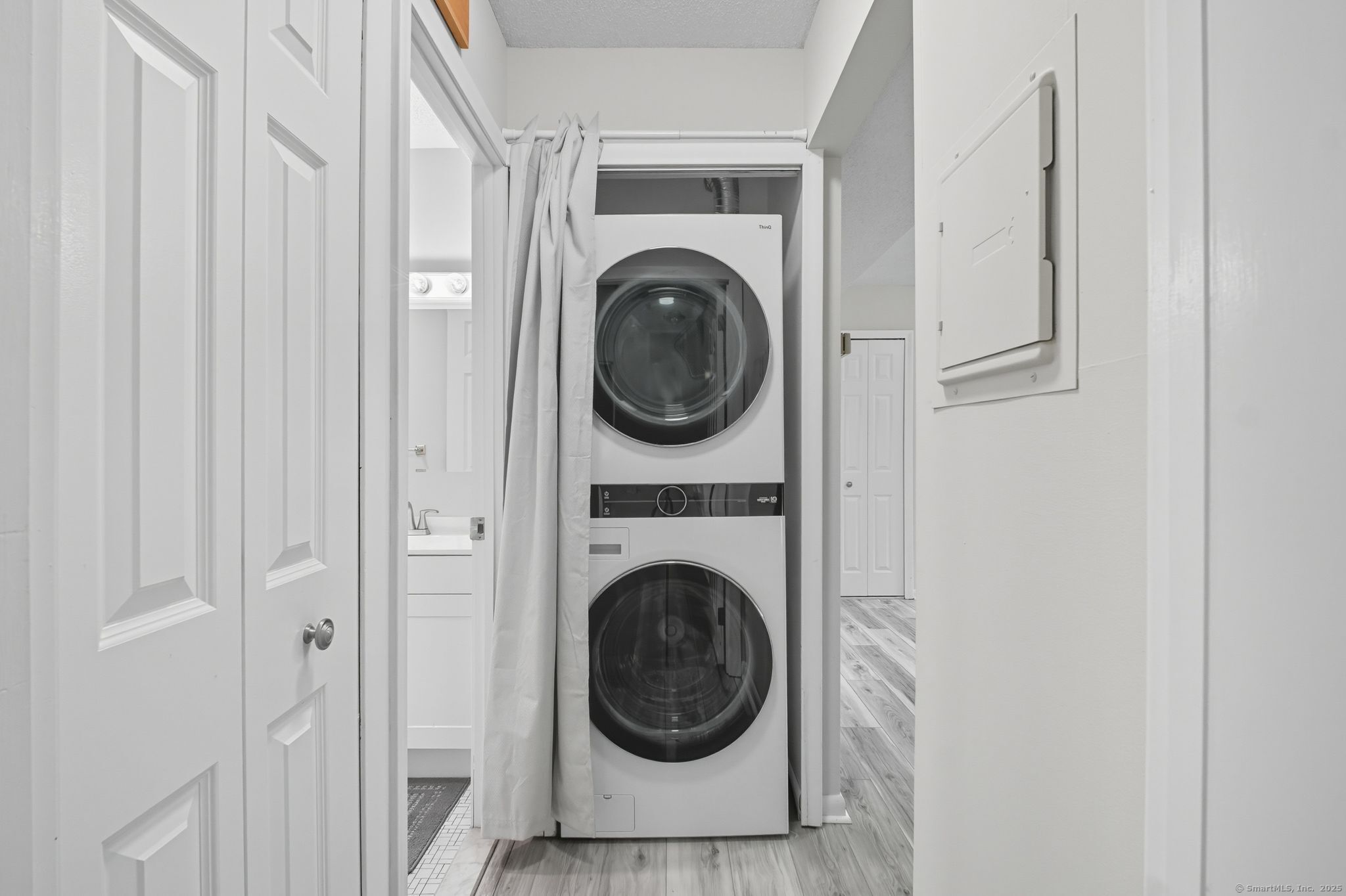 402 Twin Circle Drive, Unit 402 South Windsor, CT 06074 - Photo 12 of 18 a view of a hallway with washer and dryer