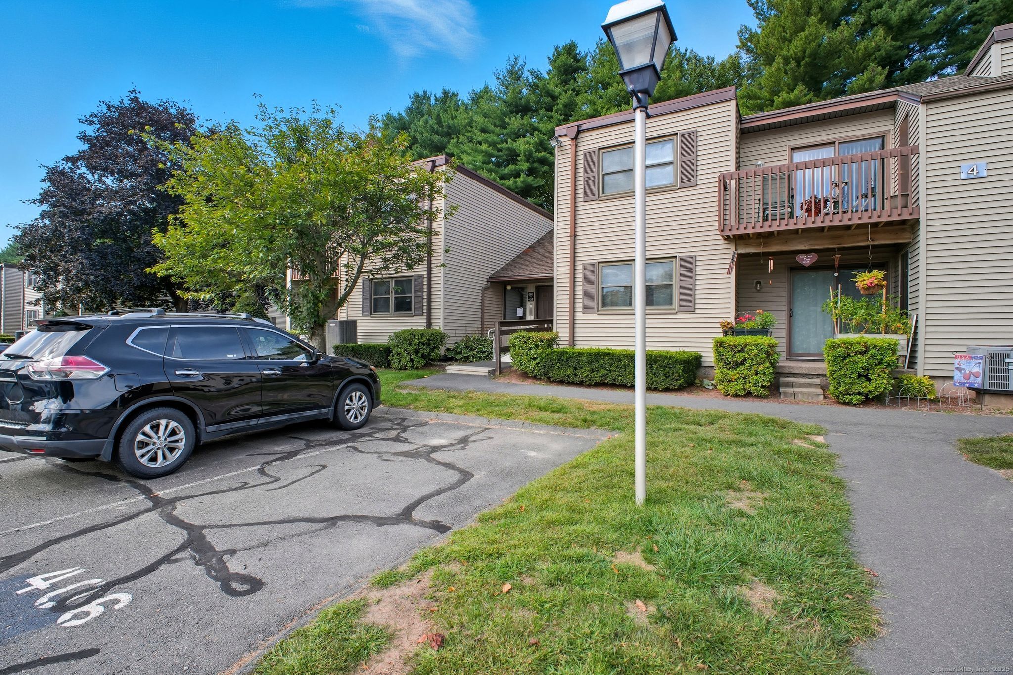 402 Twin Circle Drive, Unit 402 South Windsor, CT 06074 - Photo 17 of 18 a view of a car parked in front of a house