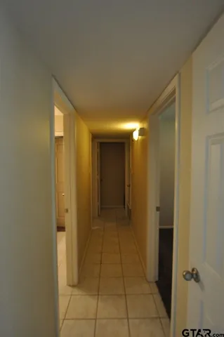 a view of a hallway with a glass door