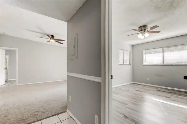 a view of an empty room with a window