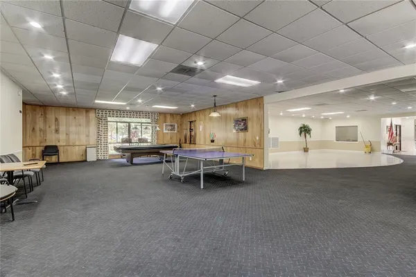 a room with lots of table and chairs