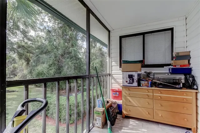 a very nice looking room with a large window and a flat screen tv