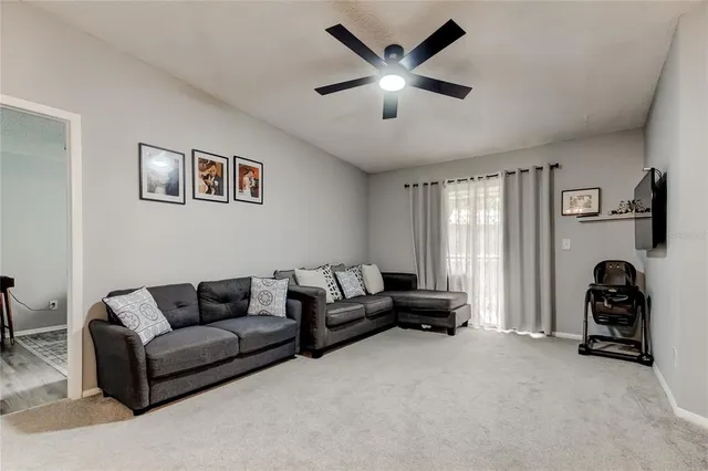 a living room with furniture and a window