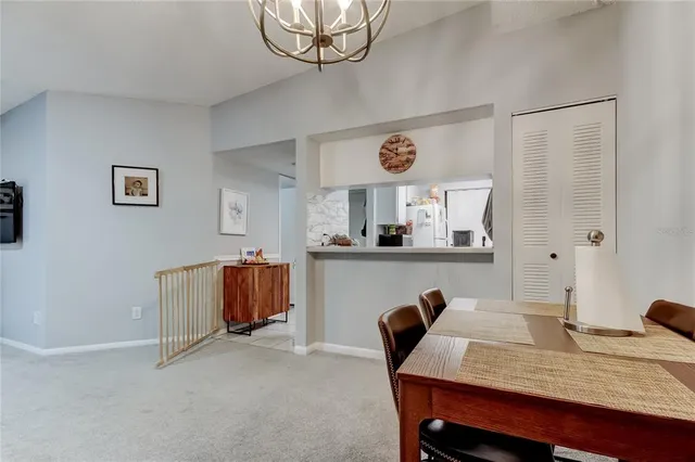 a dining room with a table and chairs