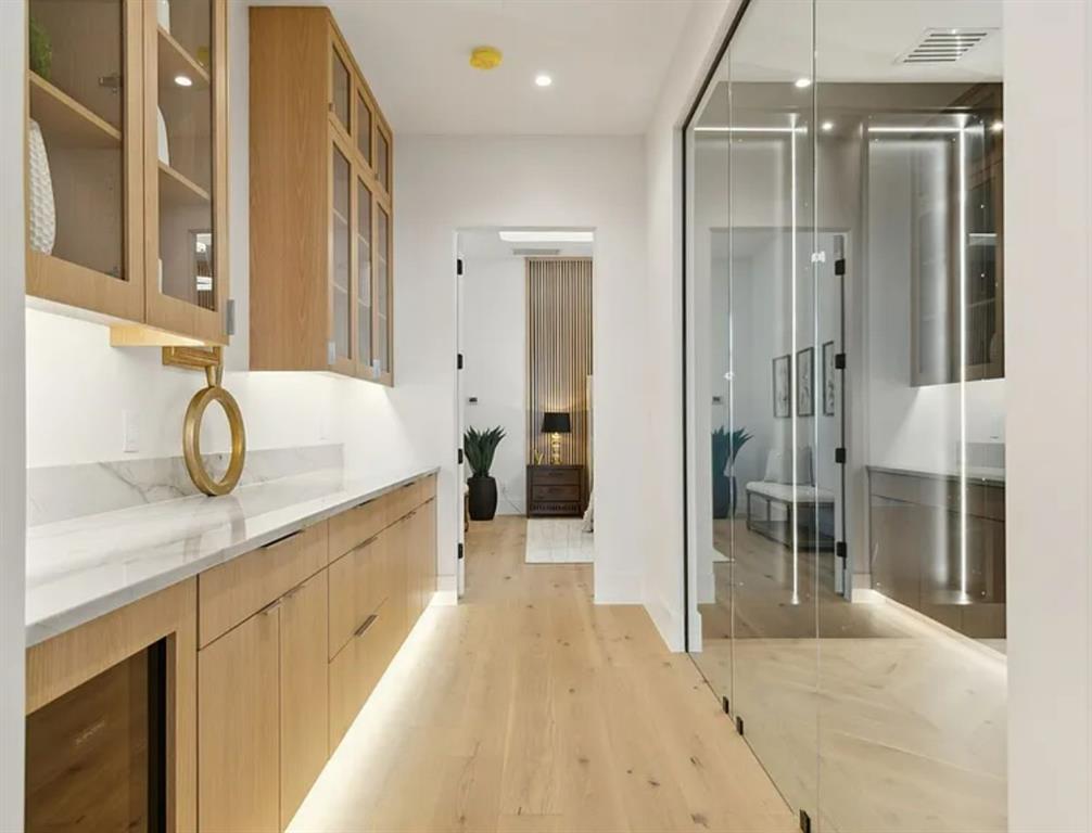 13713 Trail Creek Place Dallas, TX 75240 - Photo 12 of 15 a spacious bathroom with a granite countertop sink mirror and shower