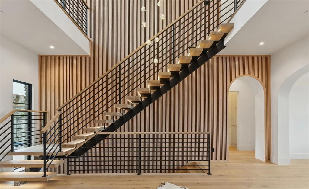 13713 Trail Creek Place Dallas, TX 75240 - Photo 3 of 15 a view of entryway and hall with wooden floor