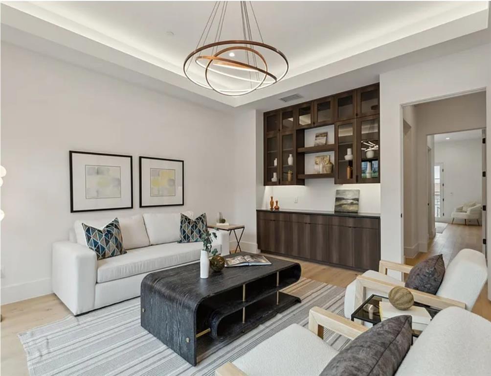 13713 Trail Creek Place Dallas, TX 75240 - Photo 4 of 15 a living room with furniture and wooden floor