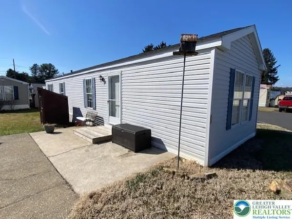 a bedroom with a bed and a television