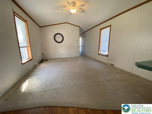 a view of an empty room with a window