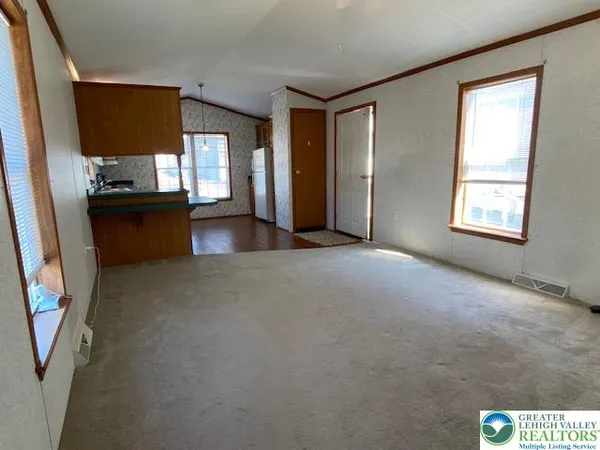 a view of livingroom with furniture and window
