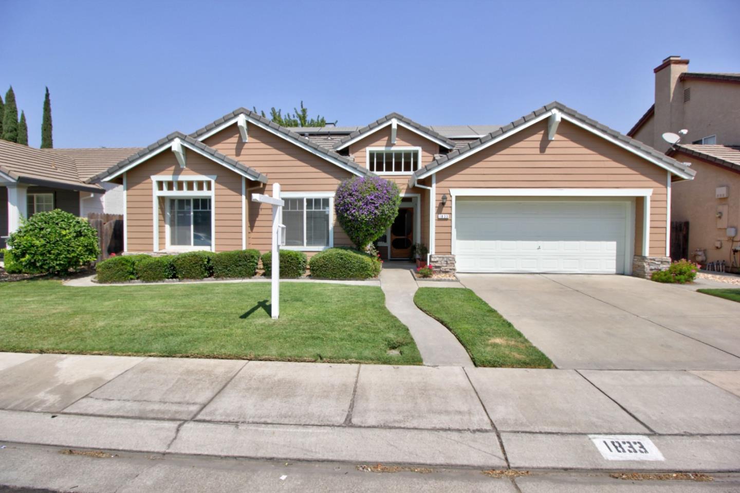 1833 Rail Street Manteca, CA 95337 - Photo 1 of 33 a front view of a house with yard