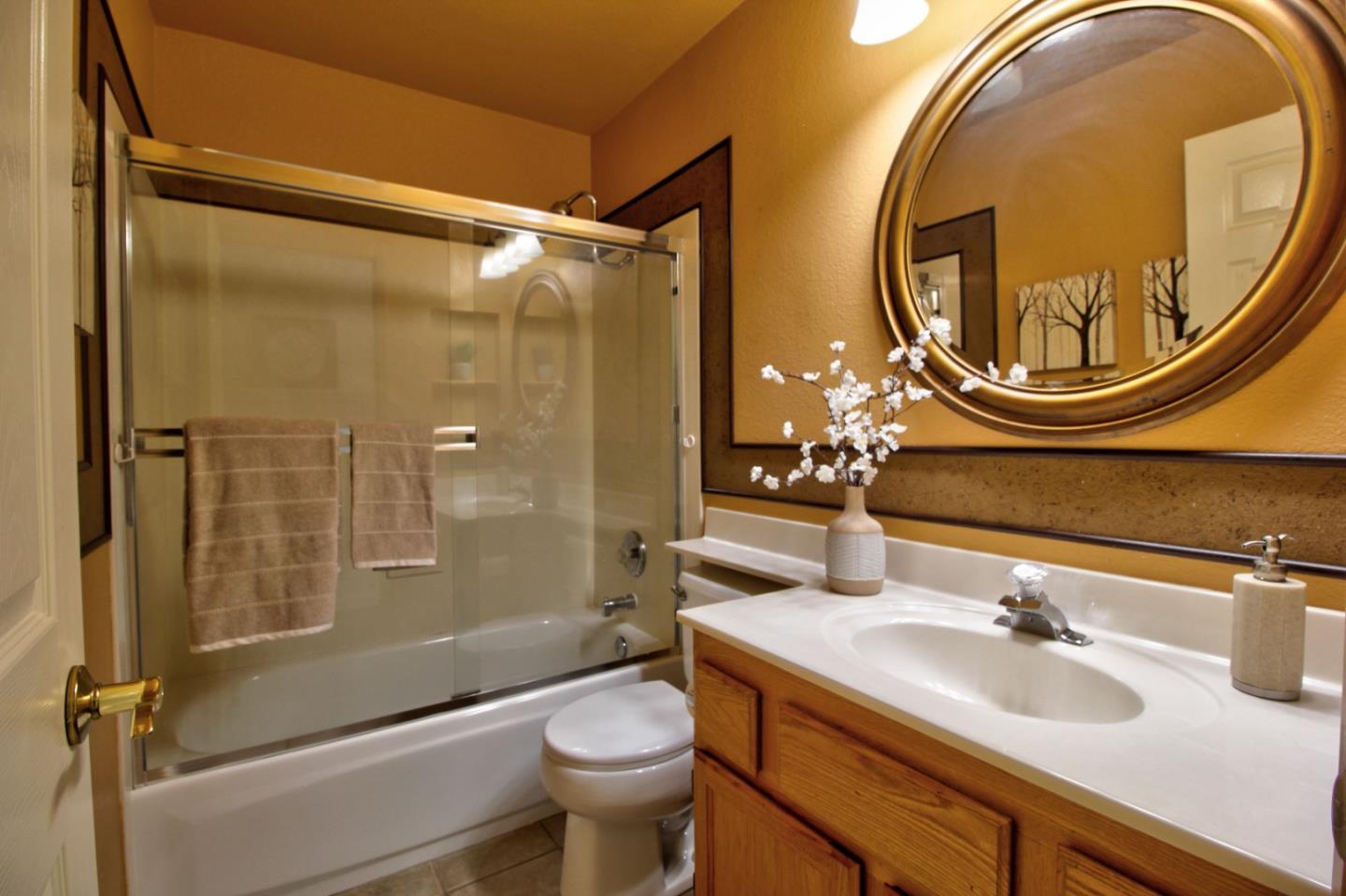 1833 Rail Street Manteca, CA 95337 - Photo 19 of 33 a bathroom with a sink and a mirror