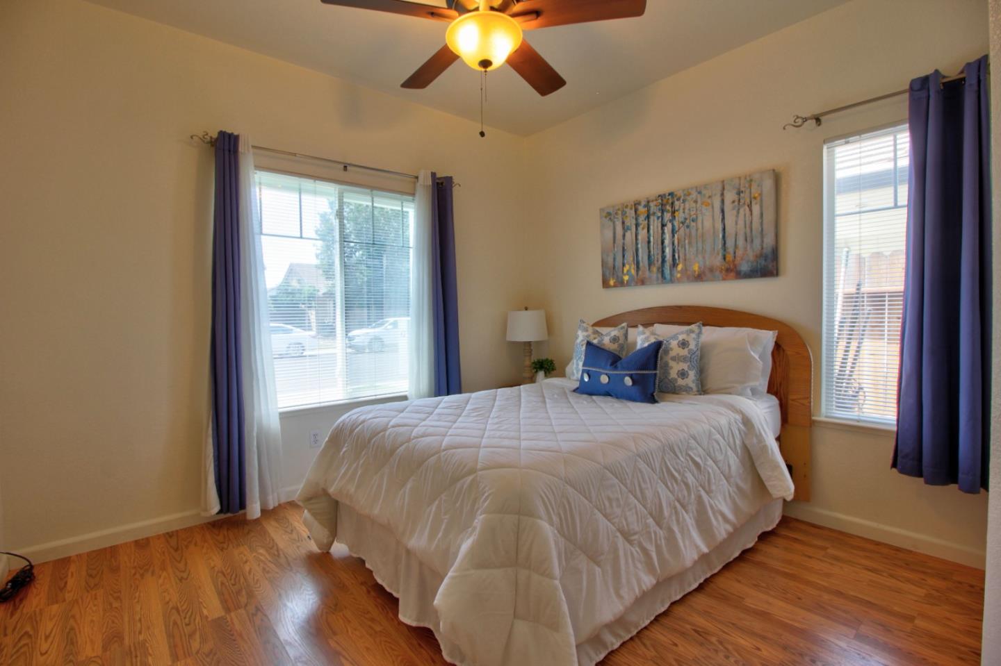 1833 Rail Street Manteca, CA 95337 - Photo 21 of 33 a bedroom with a bed and a chandelier