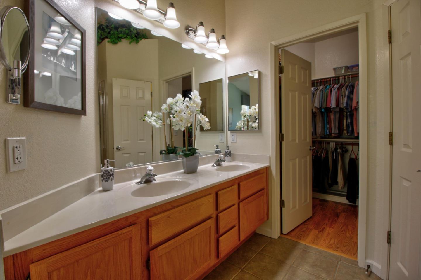 1833 Rail Street Manteca, CA 95337 - Photo 22 of 33 a bathroom with a sink double vanity and a mirror
