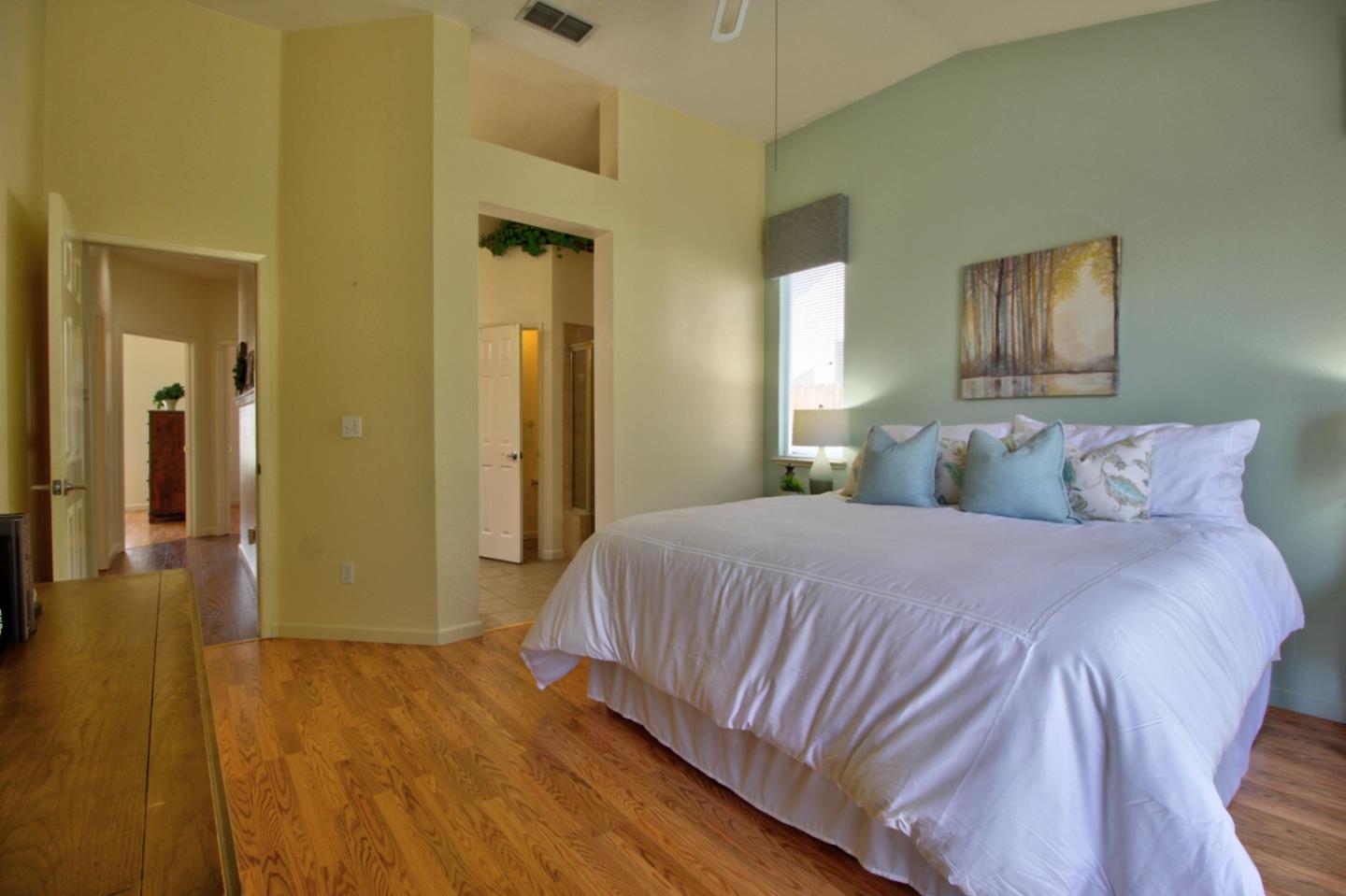 1833 Rail Street Manteca, CA 95337 - Photo 24 of 33 a bedroom with a bed and wooden floor