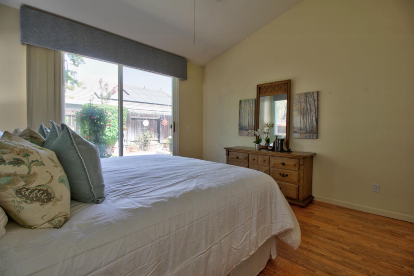 1833 Rail Street Manteca, CA 95337 - Photo 26 of 33 a bedroom with a bed and wooden floor