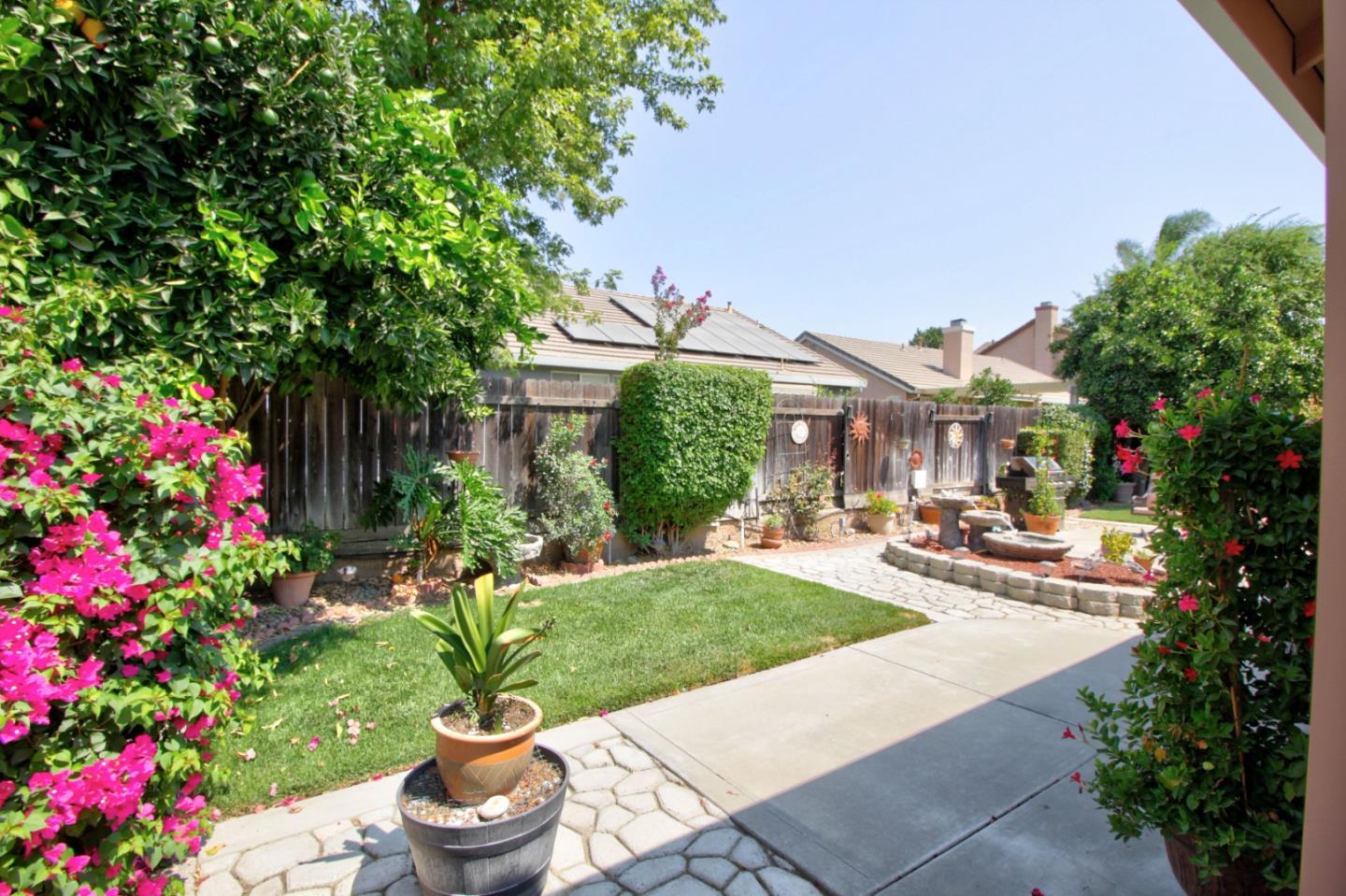 1833 Rail Street Manteca, CA 95337 - Photo 29 of 33 a view of a house with sitting area and garden