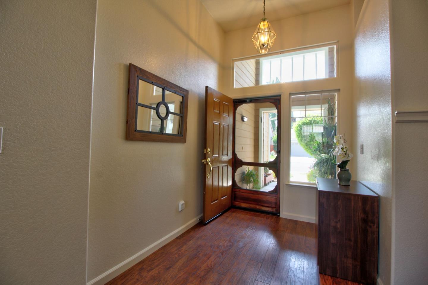 1833 Rail Street Manteca, CA 95337 - Photo 5 of 33 a view of an entryway with wooden floor