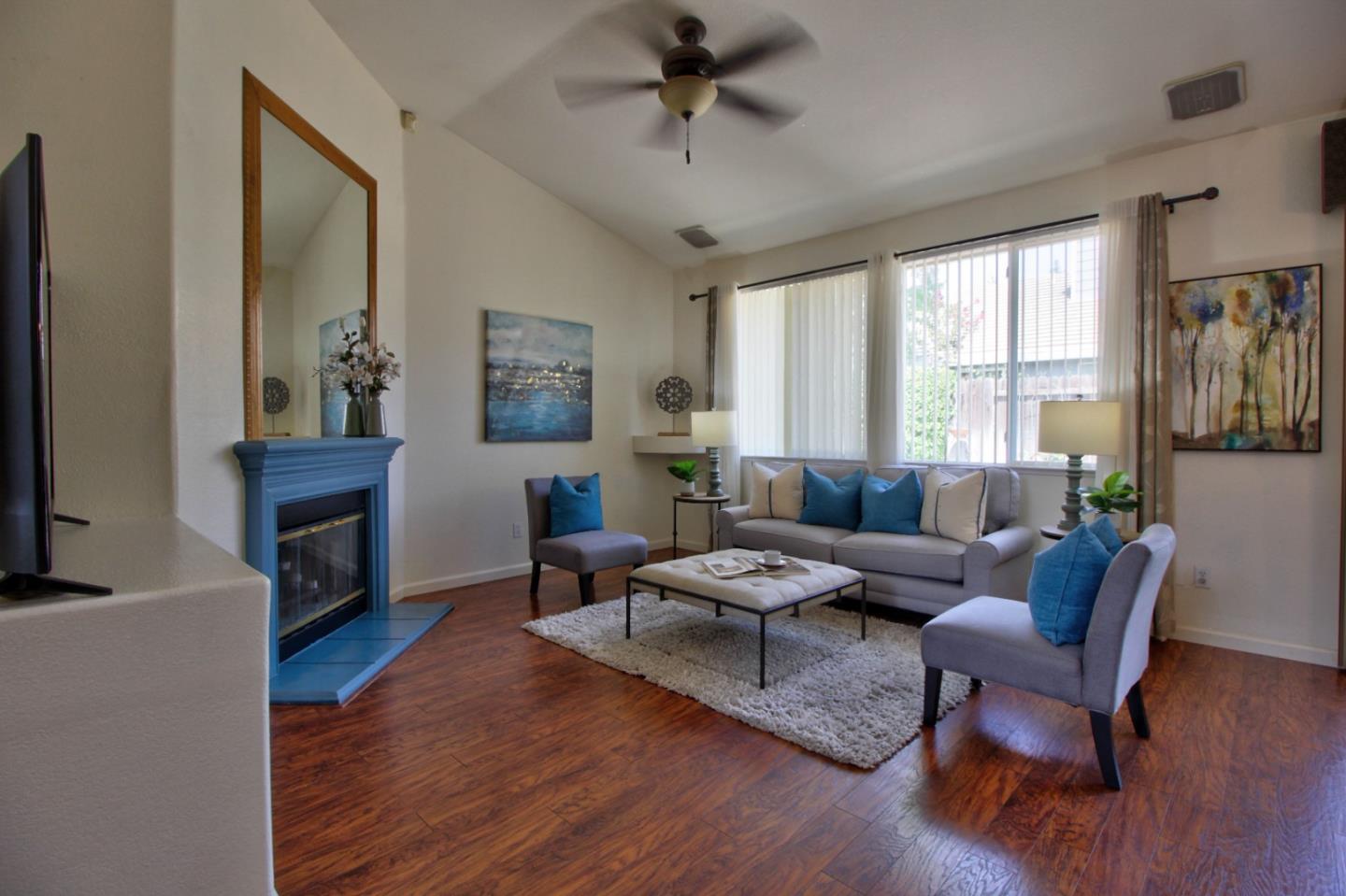 1833 Rail Street Manteca, CA 95337 - Photo 7 of 33 a living room with furniture fireplace and a window