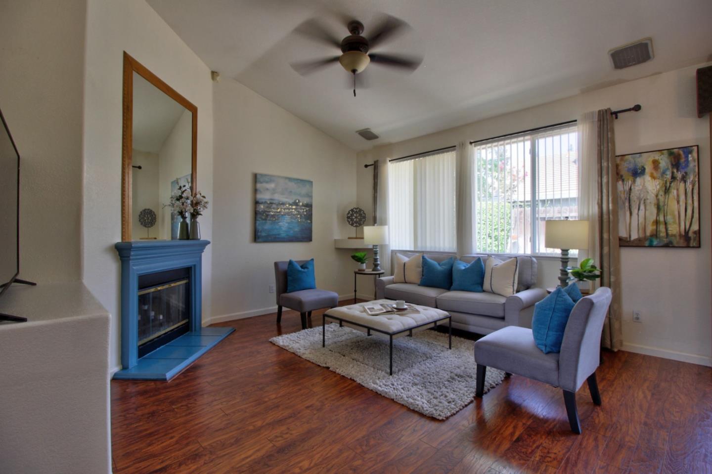 1833 Rail Street Manteca, CA 95337 - Photo 8 of 33 a living room with furniture and a fireplace
