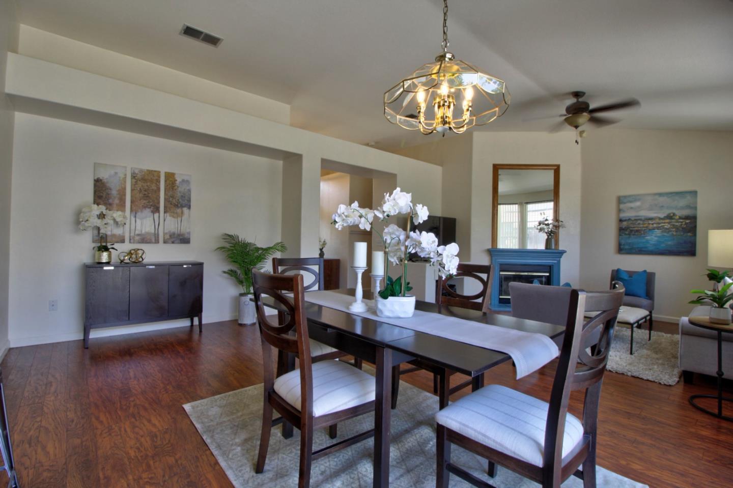 1833 Rail Street Manteca, CA 95337 - Photo 10 of 33 a view of a dining room with furniture and chandelier