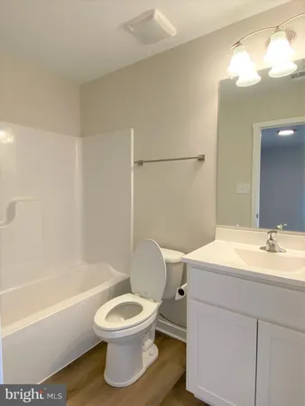 a bathroom with a toilet a sink and a bathtub