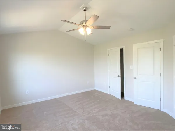 a view of a chandelier fan in a room