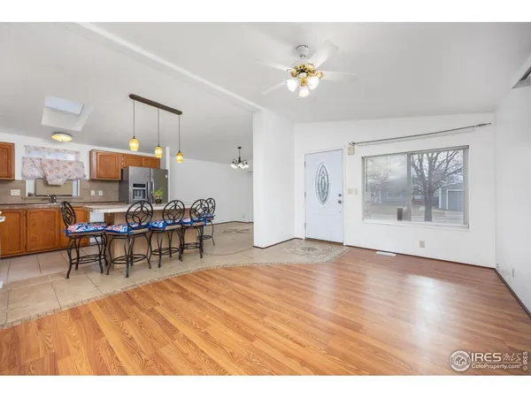 a view of a dining room with furniture and chandelier