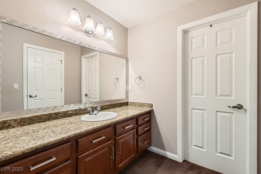 647 Foxhall Road Henderson, NV 89002 - Photo 29 of 82 Bathroom featuring baseboards and vanity