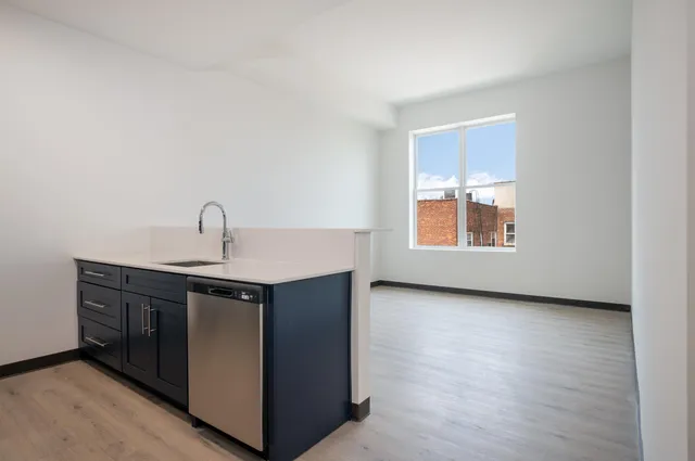 a kitchen with a sink and a window