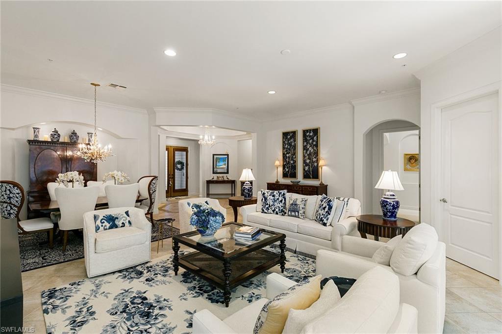28540 Calabria Court, Unit 102 Naples, FL 34110 - Photo 14 of 32 a living room with furniture