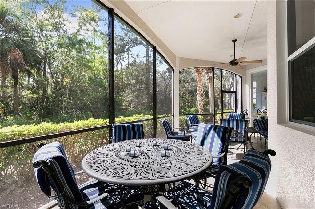 28540 Calabria Court, Unit 102 Naples, FL 34110 - Photo 32 of 32 a view of a dining room with furniture window and outside view