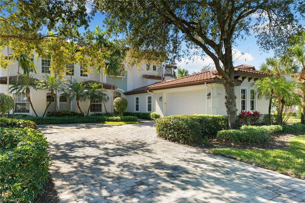 28540 Calabria Court, Unit 102 Naples, FL 34110 - Photo 8 of 32 a front view of a house with garden