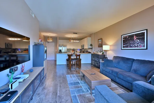 a view of kitchen and dining area with a table chairs