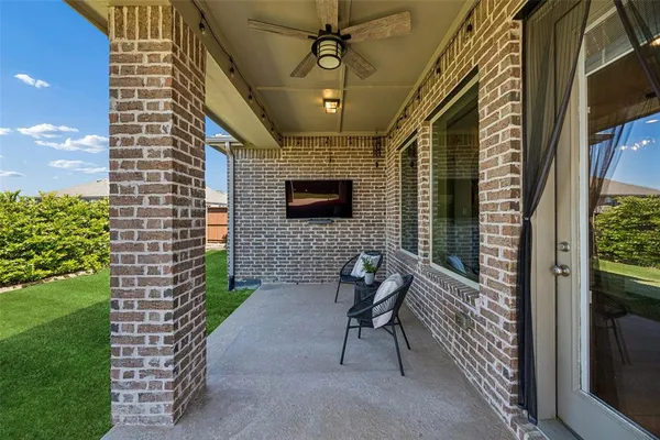 a view of an entryway with a front door and wooden floor