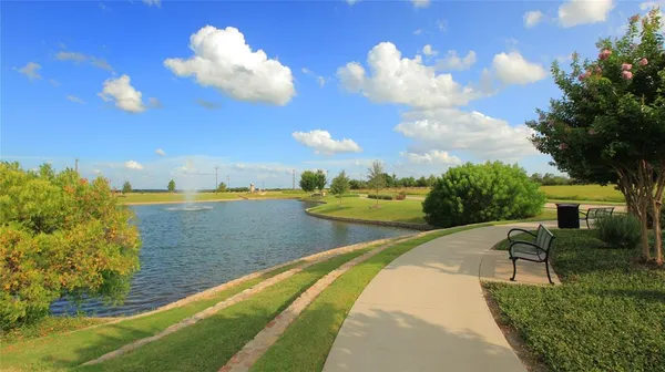 a view of a lake in between two chairs