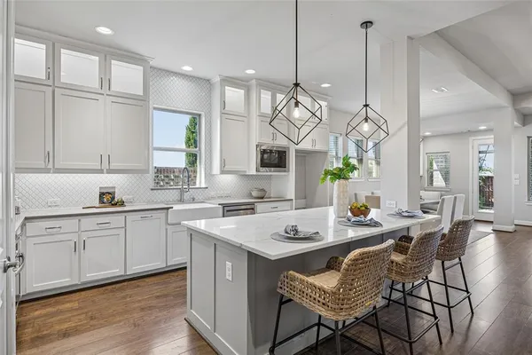 a view of a kitchen counter space a sink and living room view