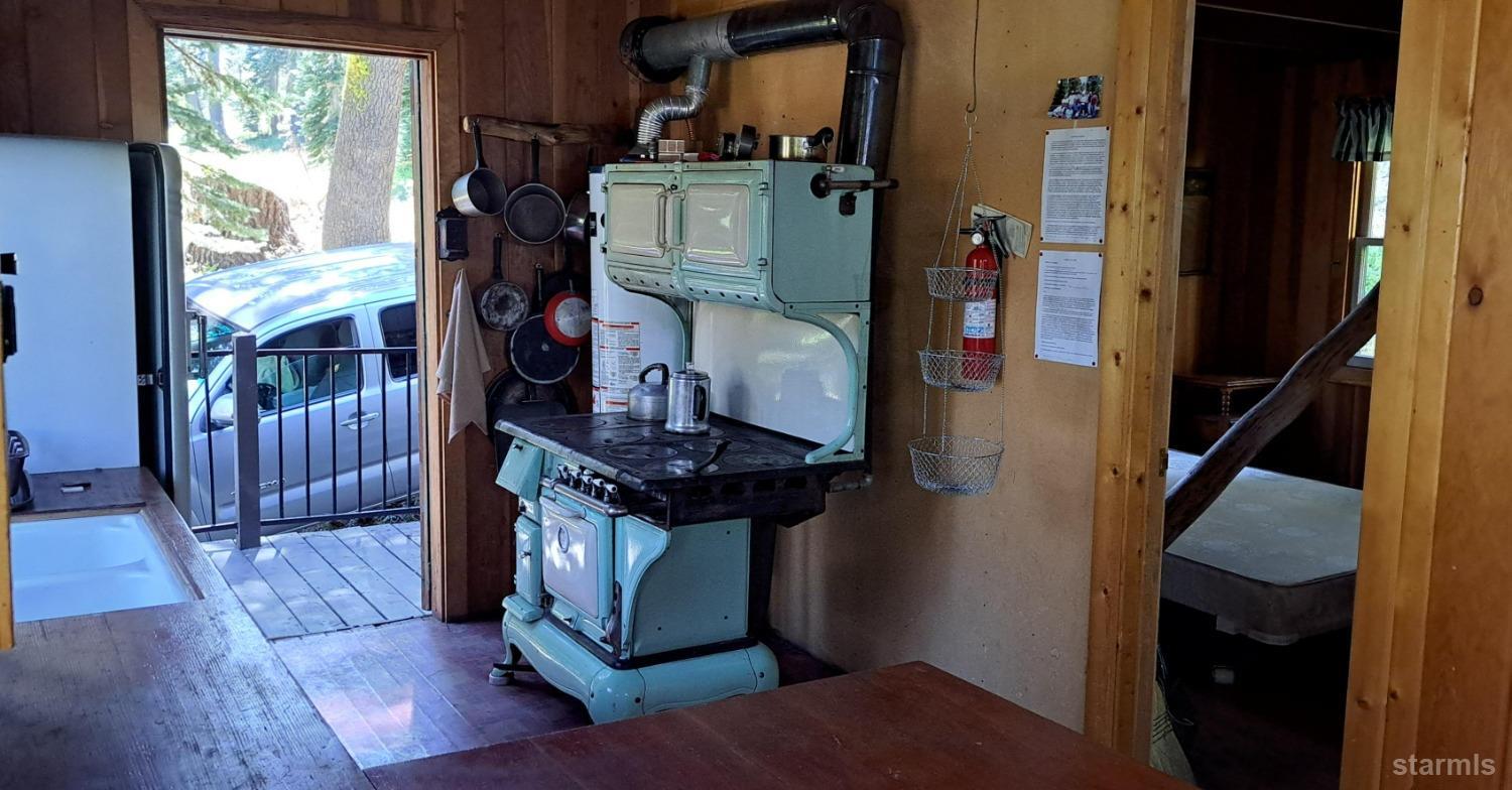 50700 Devils Gate Road, Unit 19 Kirkwood, CA 95646 - Photo 7 of 14 Wood and propane stove - bedroom behind kitchen.