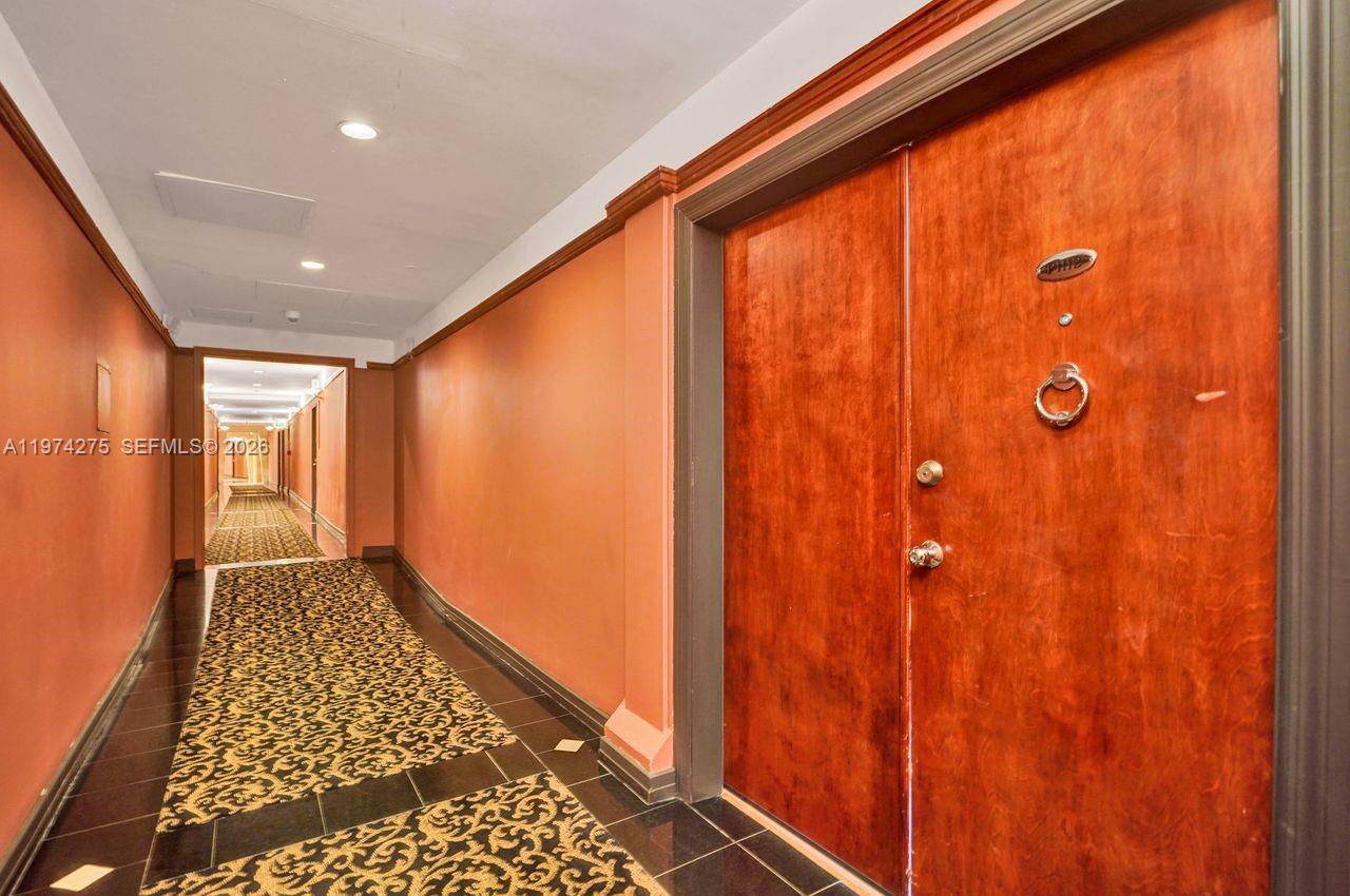 100 Lincoln Road, Unit PH12 Miami Beach, FL 33139 - Photo 50 of 59 a view of hallway with a large window
