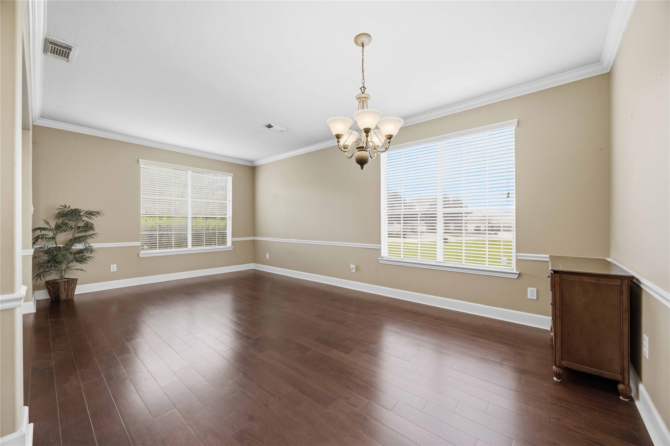 803 Northridge Terrace Lane Spring, TX 77373 - Photo 7 of 42 a view of an empty room with wooden floor and a window