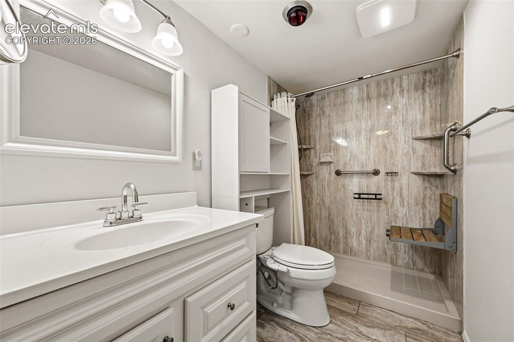 1018 Fontmore Road, Unit A Colorado Springs, CO 80904 - Photo 18 of 28 a bathroom with a sink toilet and shower