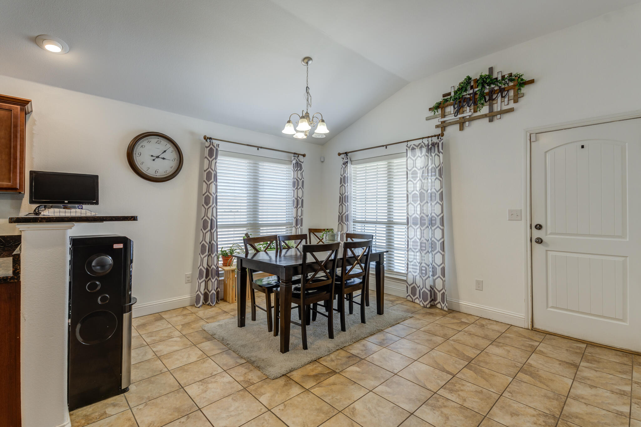 5747 110th Street Lubbock, TX 79424 - Photo 14 of 42 a view of a dining room with furniture window and wooden floor