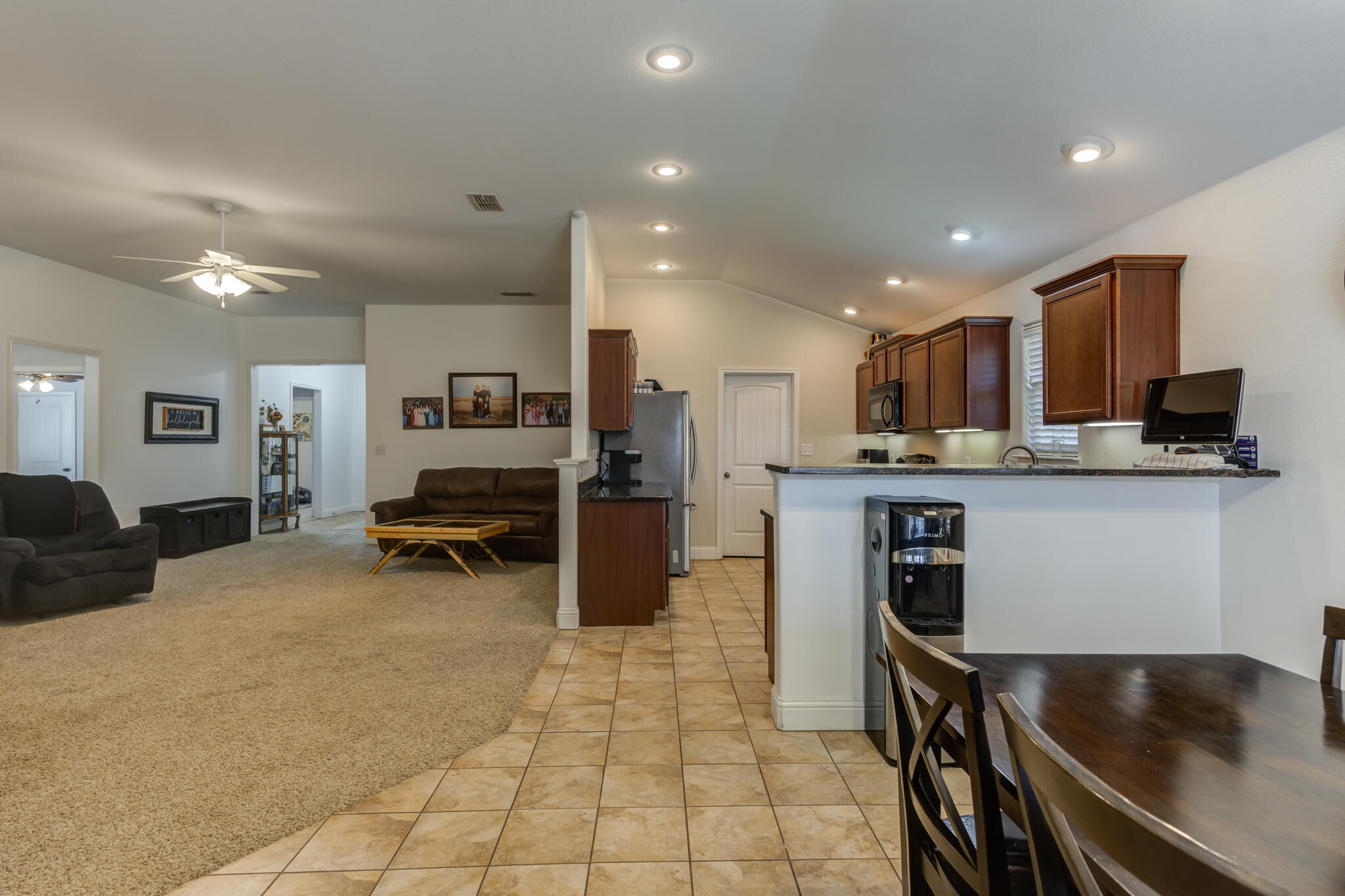 5747 110th Street Lubbock, TX 79424 - Photo 15 of 42 a kitchen with stainless steel appliances kitchen island granite countertop a sink and cabinets