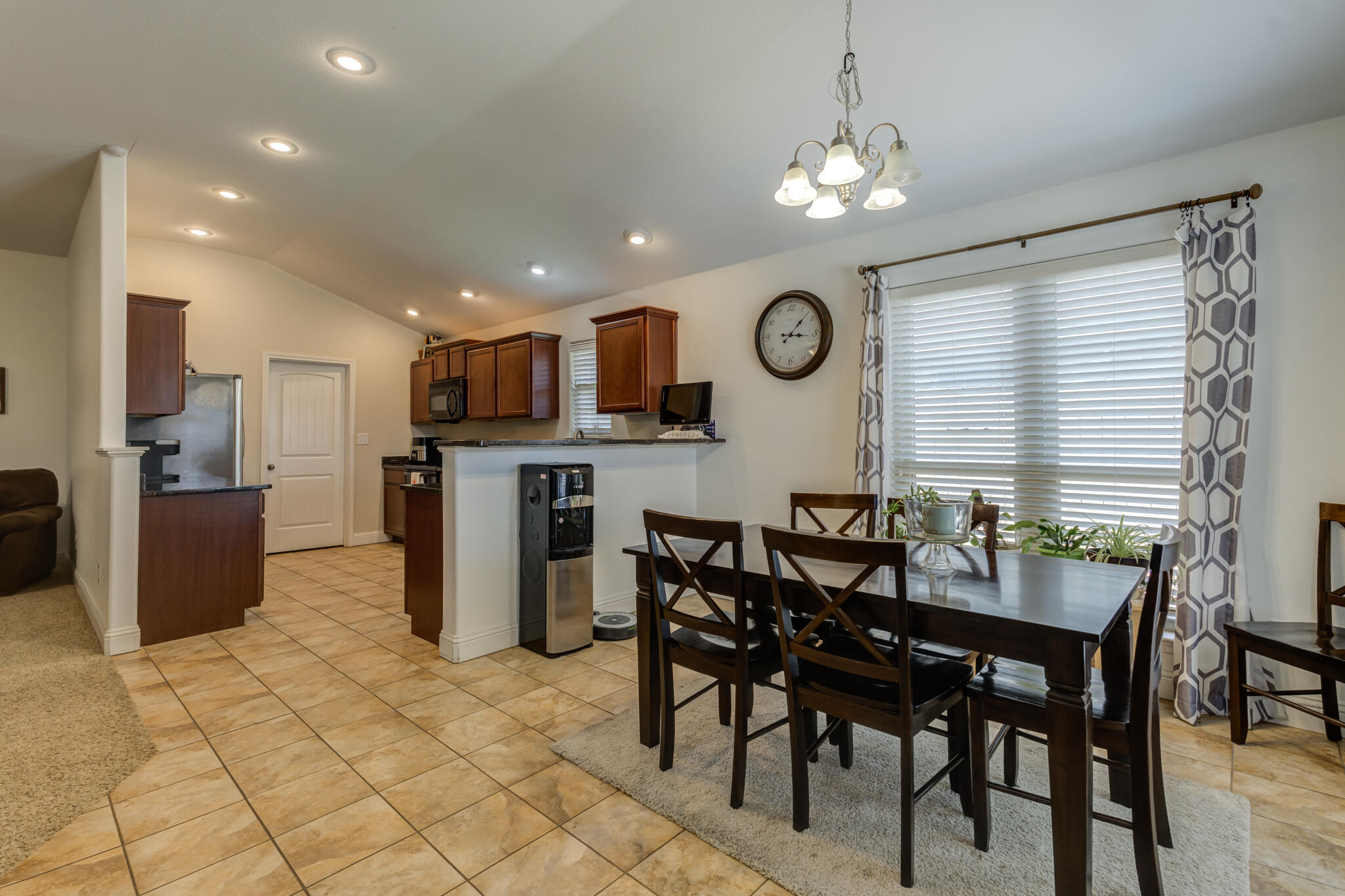5747 110th Street Lubbock, TX 79424 - Photo 17 of 42 a view of a dining room with furniture and a large window