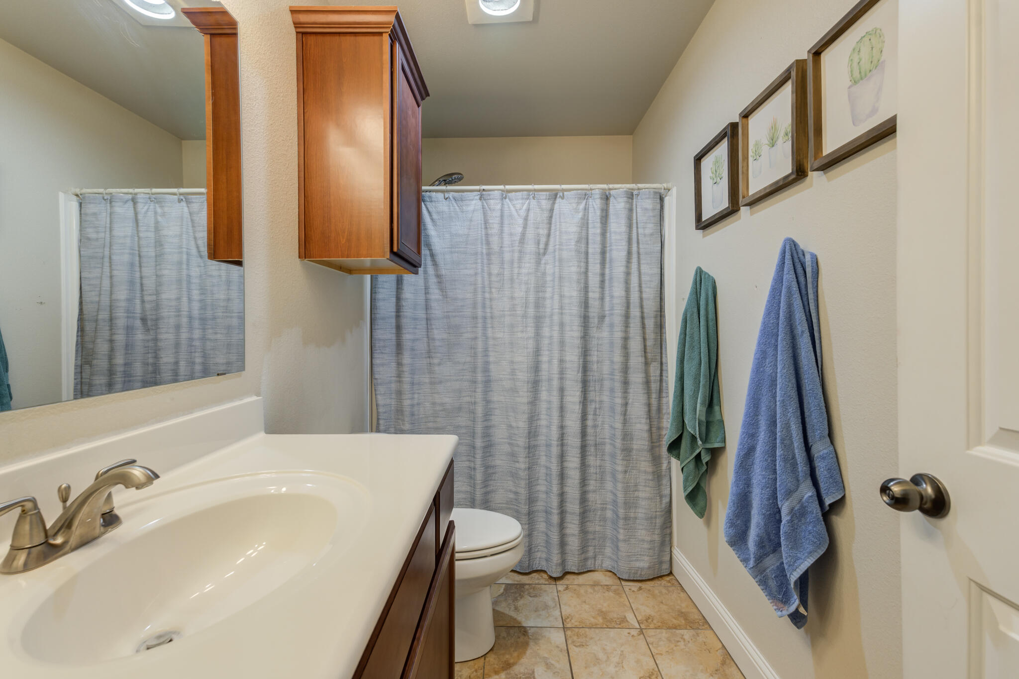 5747 110th Street Lubbock, TX 79424 - Photo 37 of 42 a bathroom with a sink toilet and shower