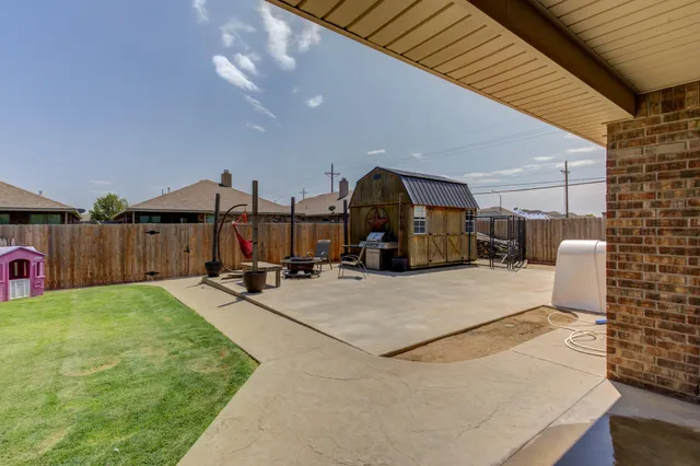 a view of a backyard with furniture