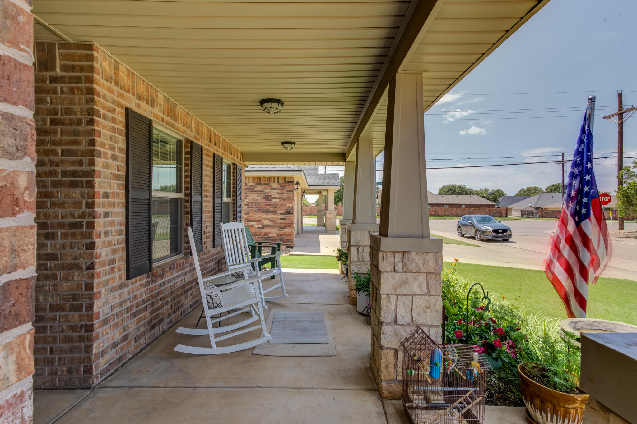 5747 110th Street Lubbock, TX 79424 - Photo 4 of 42 a balcony with chairs and a potted plant
