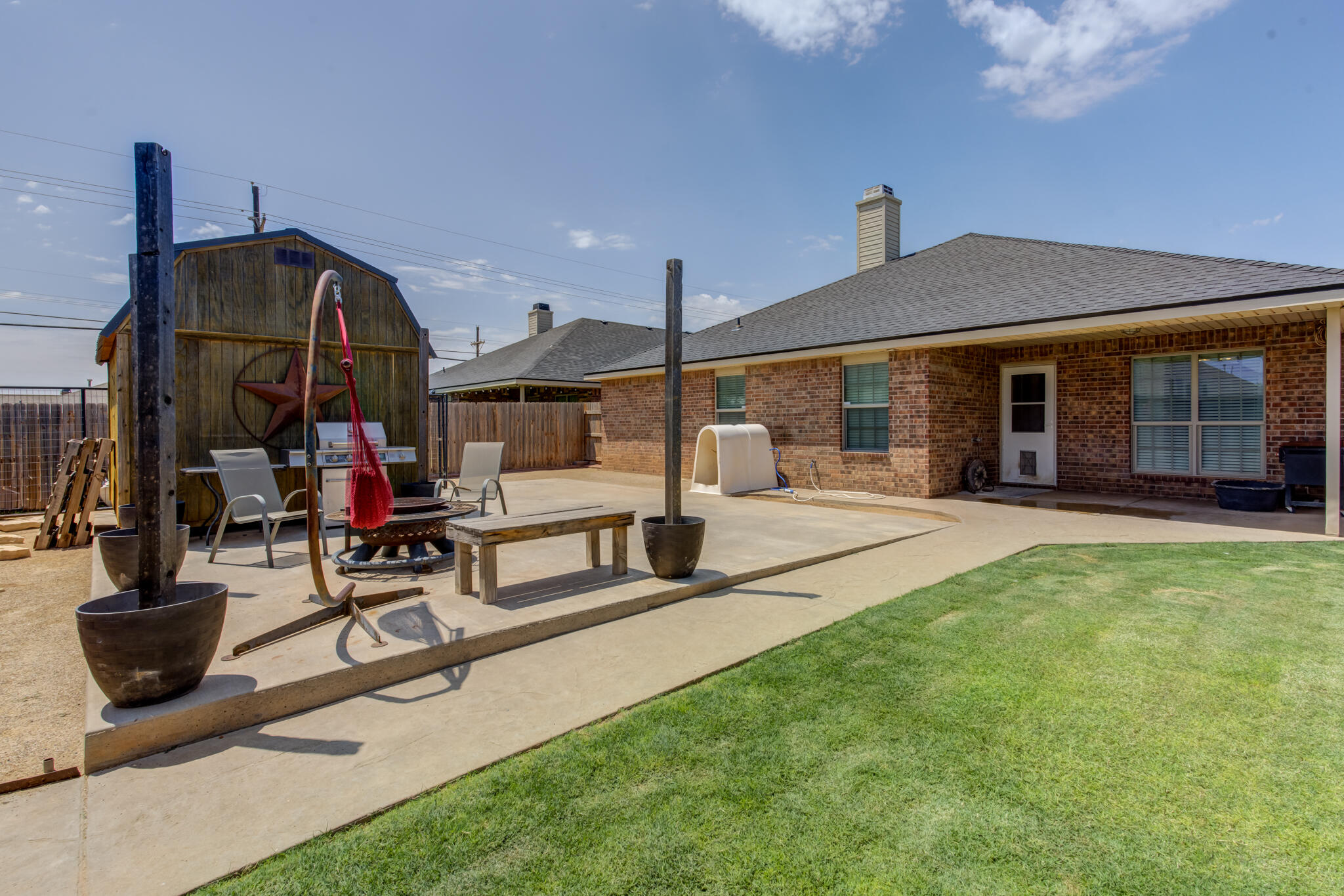 5747 110th Street Lubbock, TX 79424 - Photo 41 of 42 a view of a house with sitting area and garden