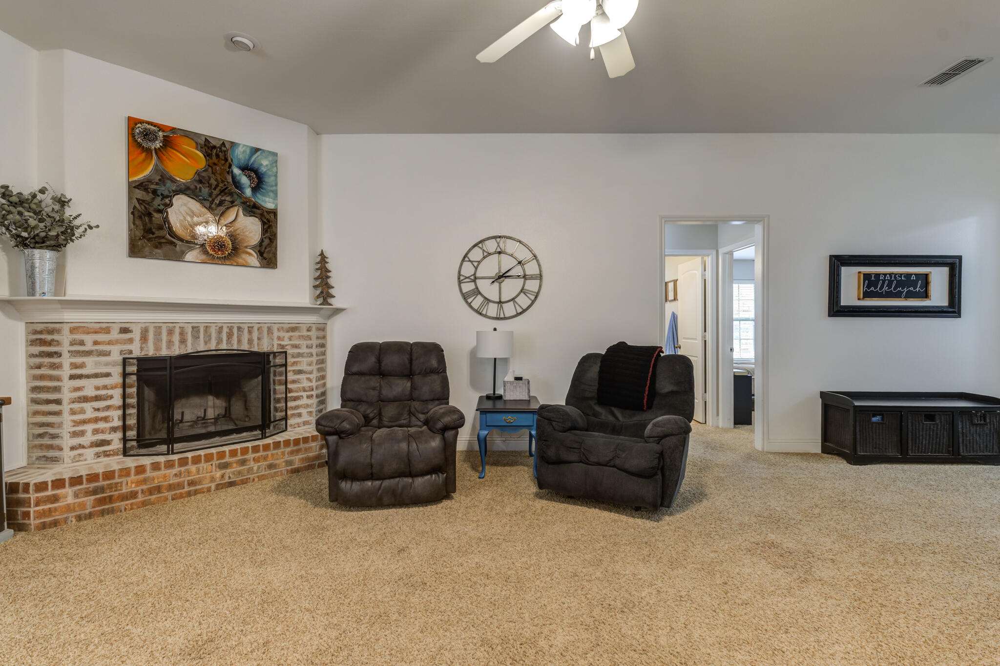 5747 110th Street Lubbock, TX 79424 - Photo 10 of 42 a living room with furniture and a fireplace